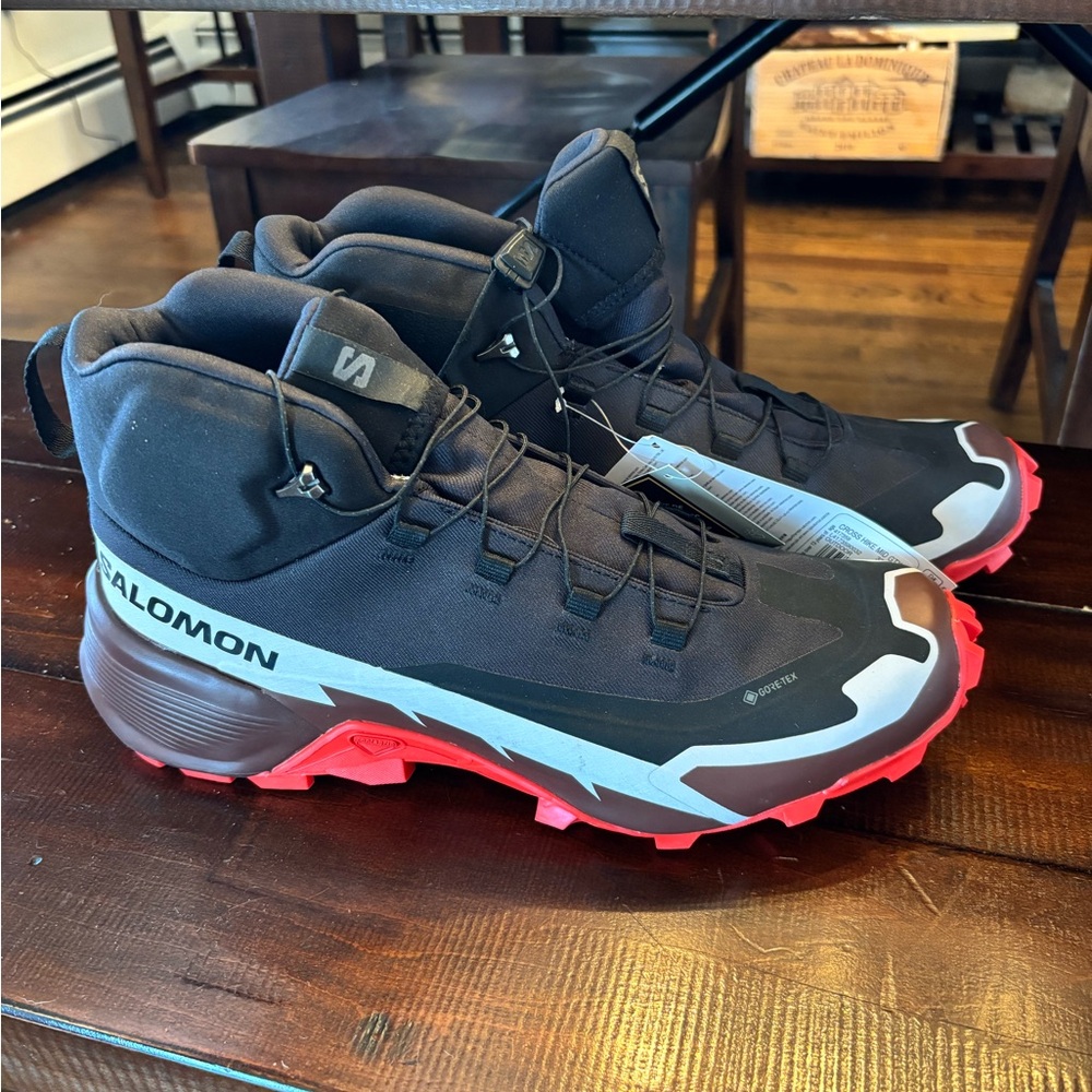 Salomon Black and Red Athletic Shoes with Rugged Design